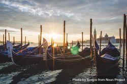 Wooden boats on seashore during sunset 5k6qQ0