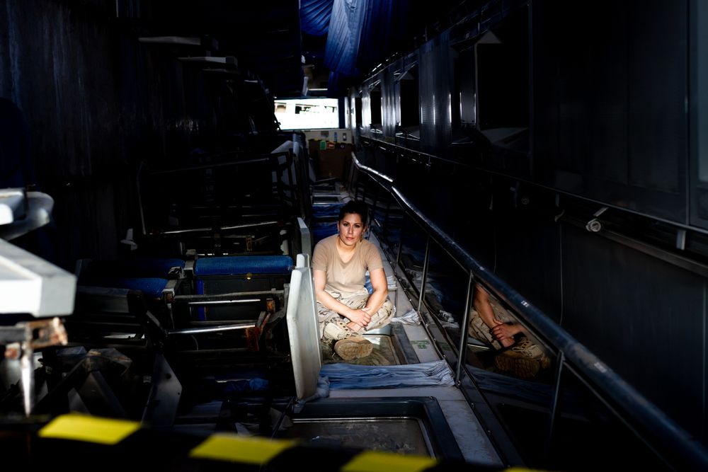 Military woman inside hangar