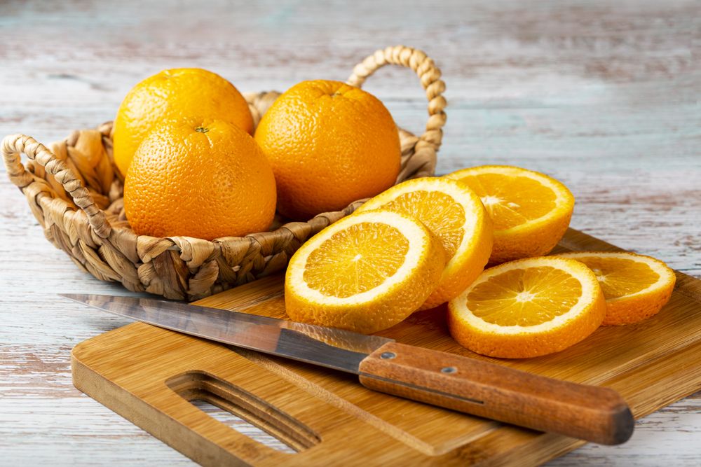 Sliced oranges on the table.