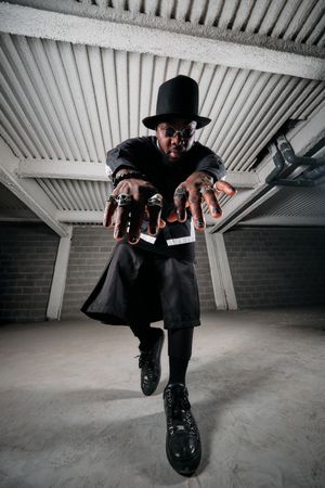 Extravagant Black man dancing in garage