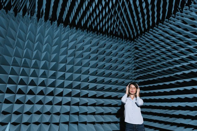 Woman in sound room listening to music