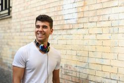 Portrait of happy young man with headphones