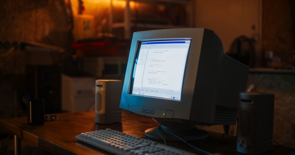 Dated PC Has Operating System Terminal Opened, Prompts Running On Screen, Code Functioning Successfully.