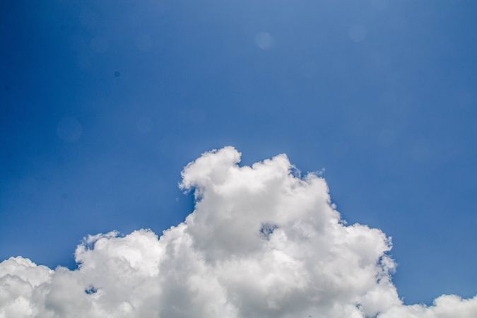 Fluffy clouds in blue sky