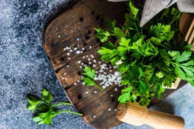 Top view of parsley and salt on board