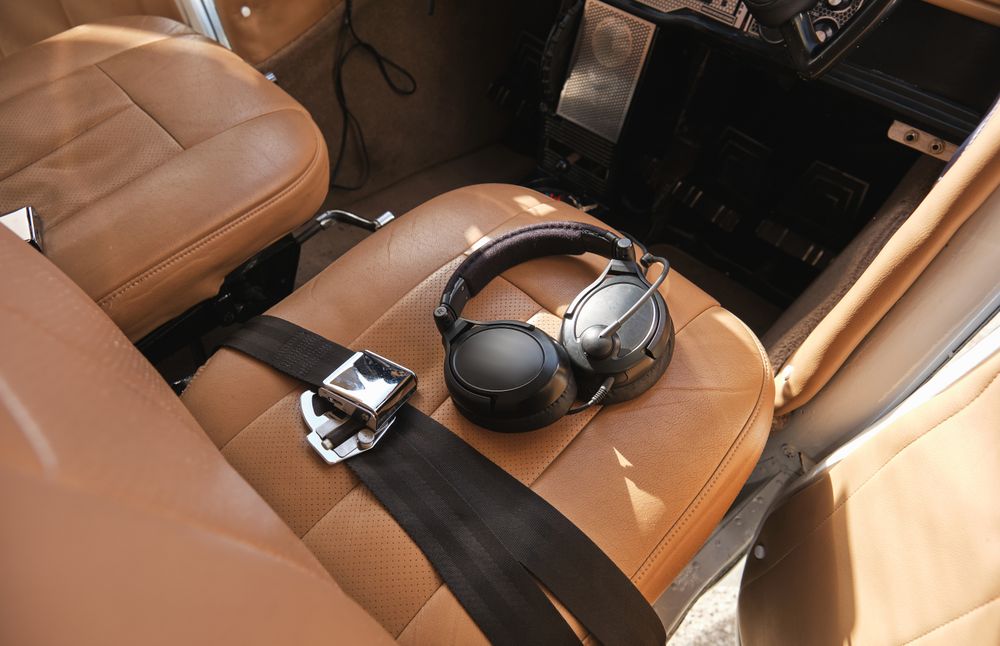 Modern headgear placed on seat in cockpit
