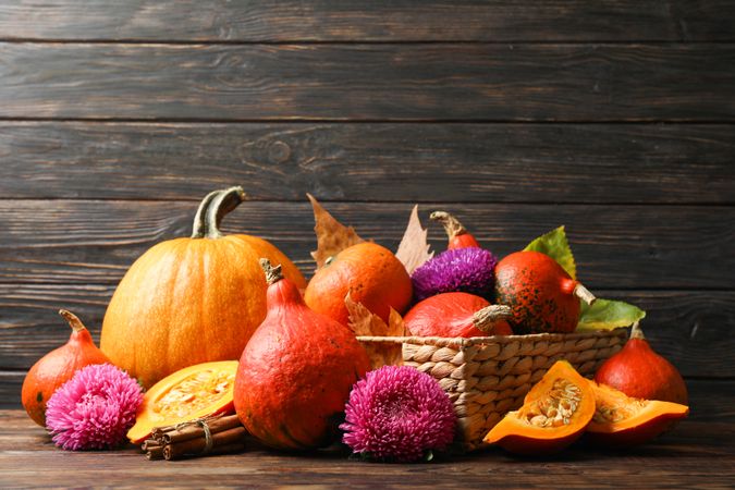 Harvest composition with pumpkins on wooden background, space for text