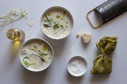 Kitchenware and condiments near asparagus cream soup