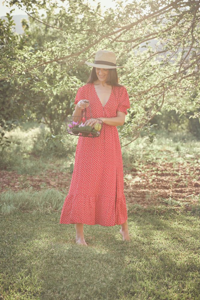 Adult lady with basket in countryside