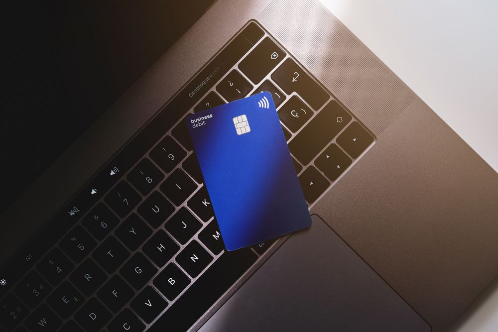 Business debit card on laptop