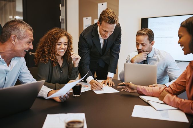 Group of people working together around a table