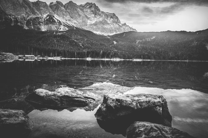 Monochrome landscape with mountains reflected in water