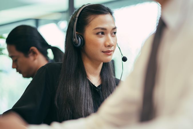 Female operator on the phone in call center