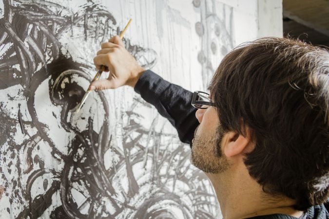 Painter artist working on a oil canvas