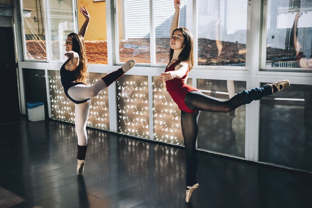 Young ballerinas dancing expressively