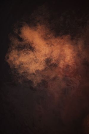 Smoke over water in brown light