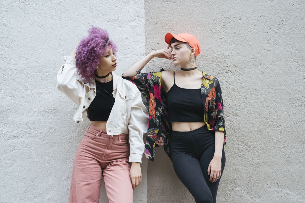 Women leaning and looking at each other