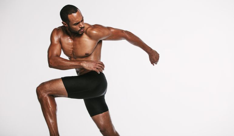 Athletic Black male doing abdomen twist