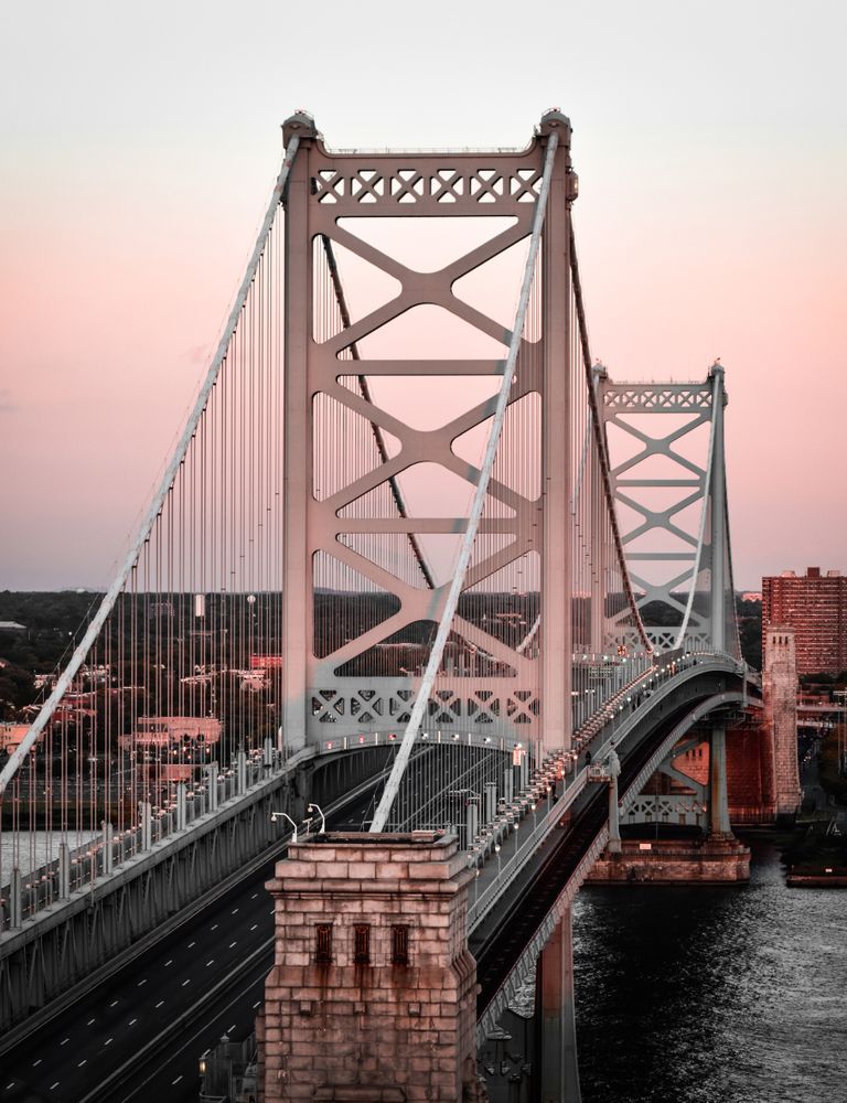 Brown bridge over body of water