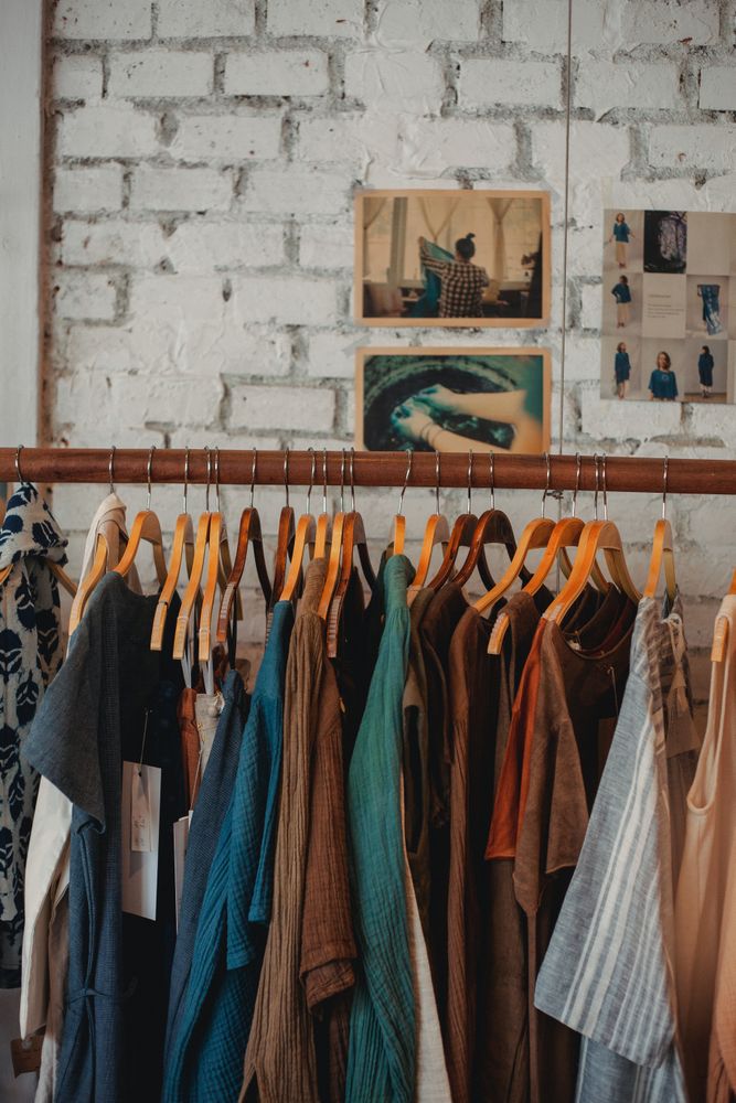 Clothing rack of brown and blue shirts