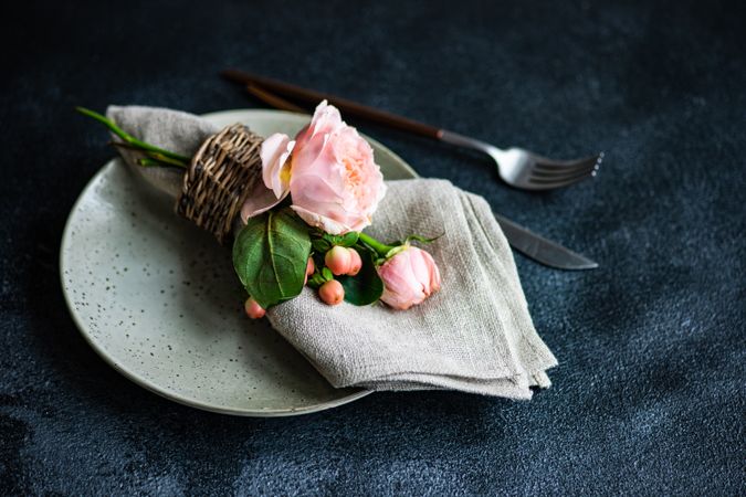 Delicate pink flowers on grey plate