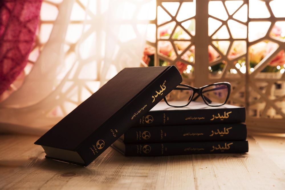 Stack of books by Iranian author