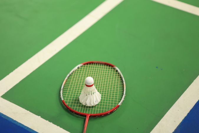 Badminton Sport Equipments, Shuttlecocks and Rackets, on PV Floor of Indoor Badminton Court
