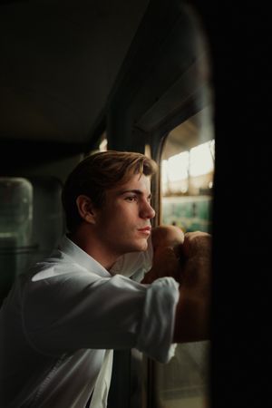 Traveler looking out train window