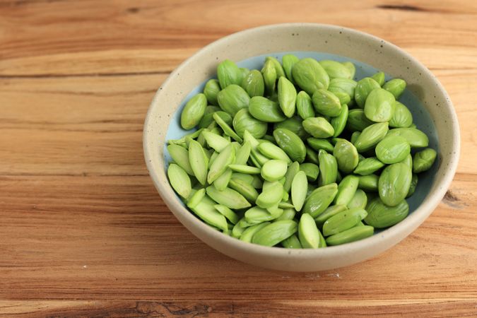 Petai Kupas Raw Green Stinky Bean on Ceramic Bowl