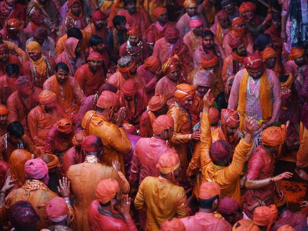 Group of men covered with bright paintings as ritual in celebrating Holi in India