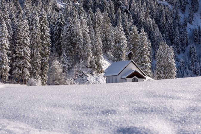 Snow-covered church, winter landscape on a sunny day in December