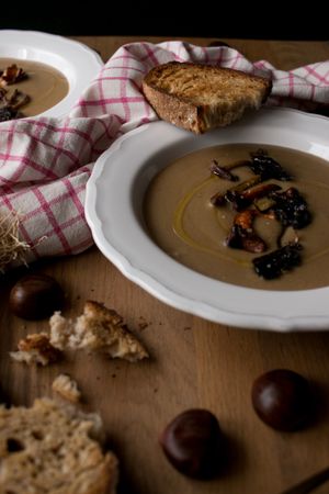 Bread and scallion near chestnut soup