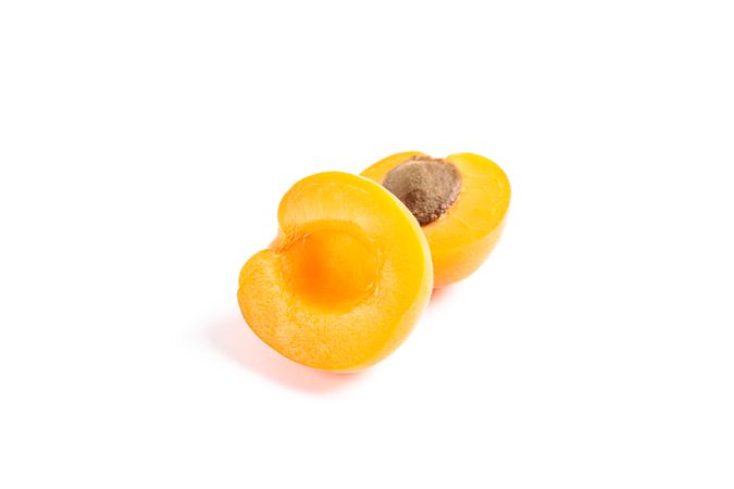 Fresh sweet apricots isolated on blank background