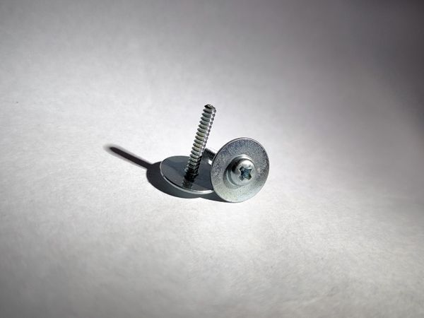 Screws on plain background