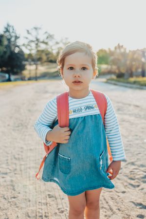 Little girl standing in park