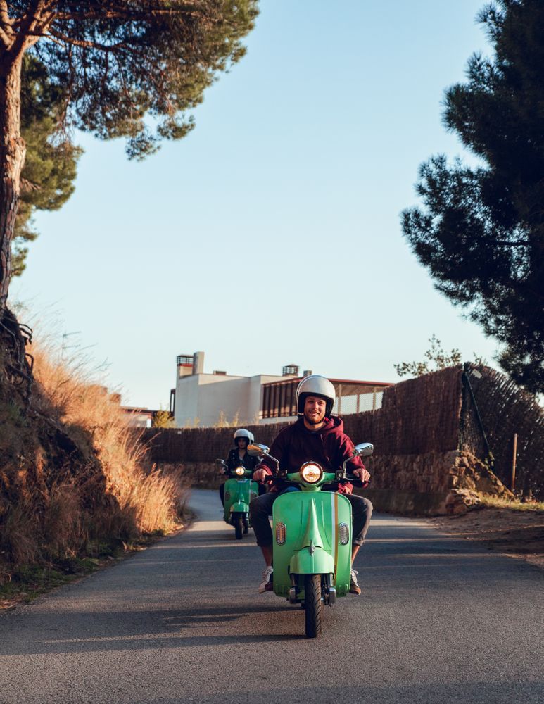 Young people riding motorcycles on city road