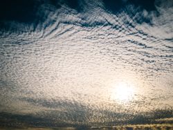 Picturesque cloudy sky at sundown