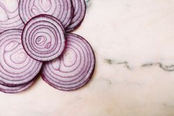 Slices of onion on tabletop