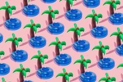 Tropical palm inflatable toy pattern on pink background