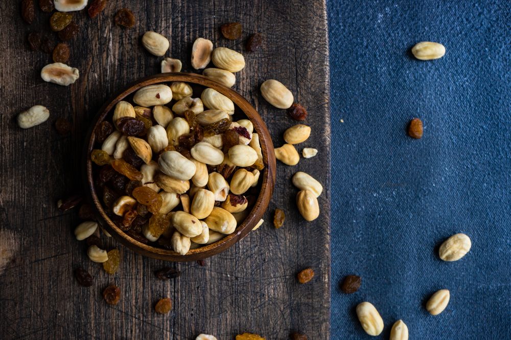 Top view of healthy nuts on dark background