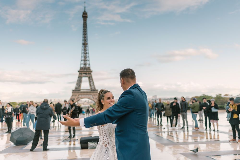 Happy newlyweds in wedding clothing dancing together