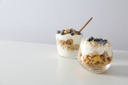 Tasty and nutritious breakfast concept - muesli with yogurt