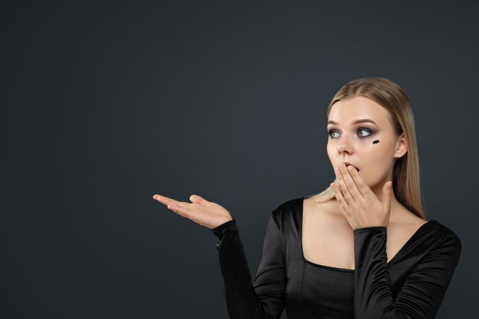 A woman with dark makeup for a Halloween party