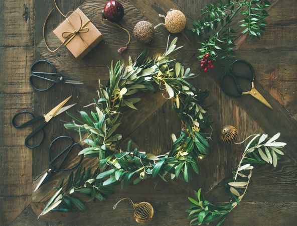 Olive branch festive wreath with scissors and holiday decorations