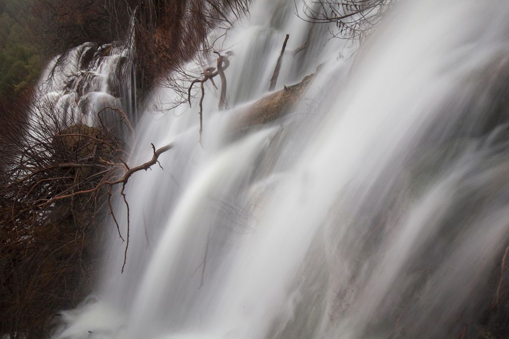 Wonderful waterfall near tree