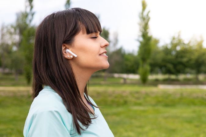 Runner woman relaxed listening to music for training outdoors
