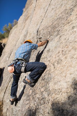 Free climber climbing in nature