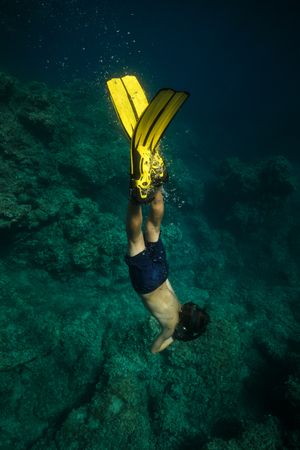 Anonymous boy diving in sea