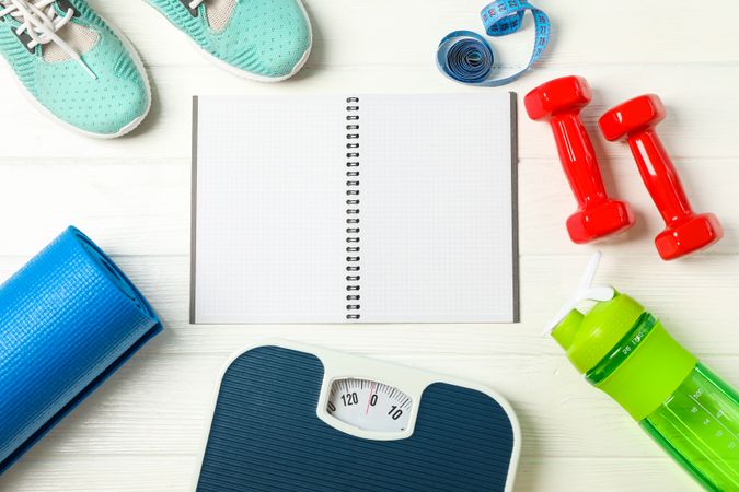 Flat lay composition with loss weigh accessories on blank wooden background