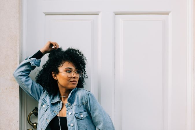 Fashionable female by door